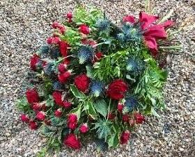 Sheaf of red roses and foliage