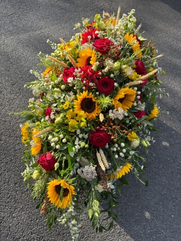 Rose and sunflower funeral spray